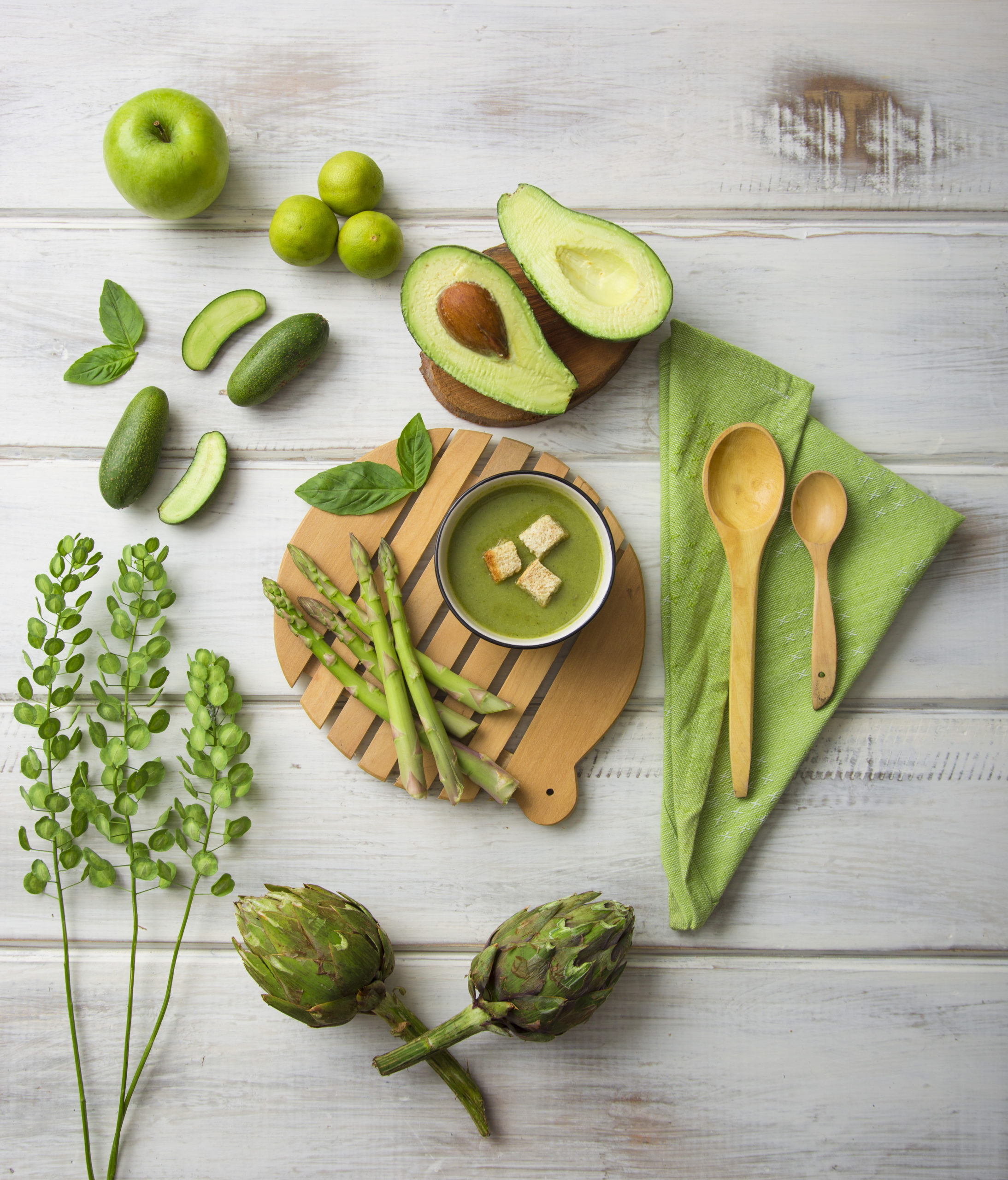 green kitchen utensils vegetables wooden floor avocado artichokes scaled